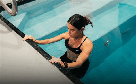 woman relaxing in a recovery pool