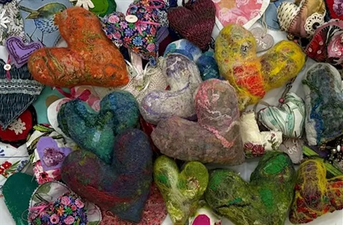 assorted colourful hand-made fabric hearts