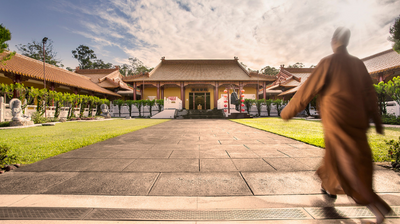 Monk walking at Chung Tian Temple