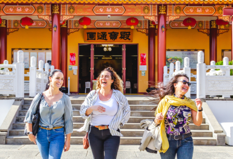 3 women laughing and walking at Chung Tian Temple