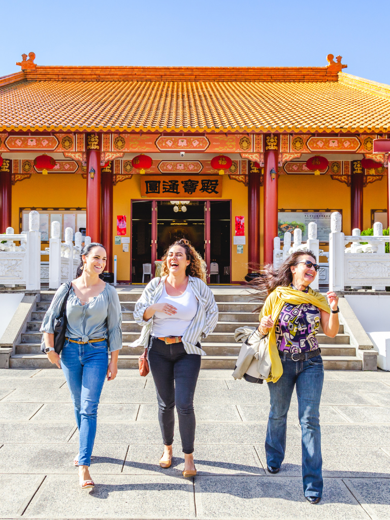 3 women laughing and walking at Chung Tian Temple