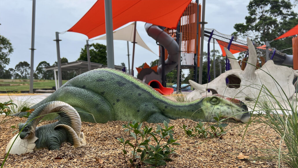 dinosaur statues on a playground