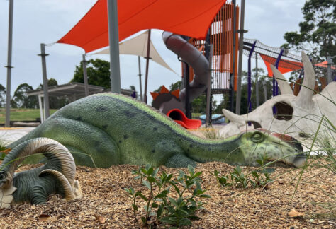 dinosaur statues on a playground
