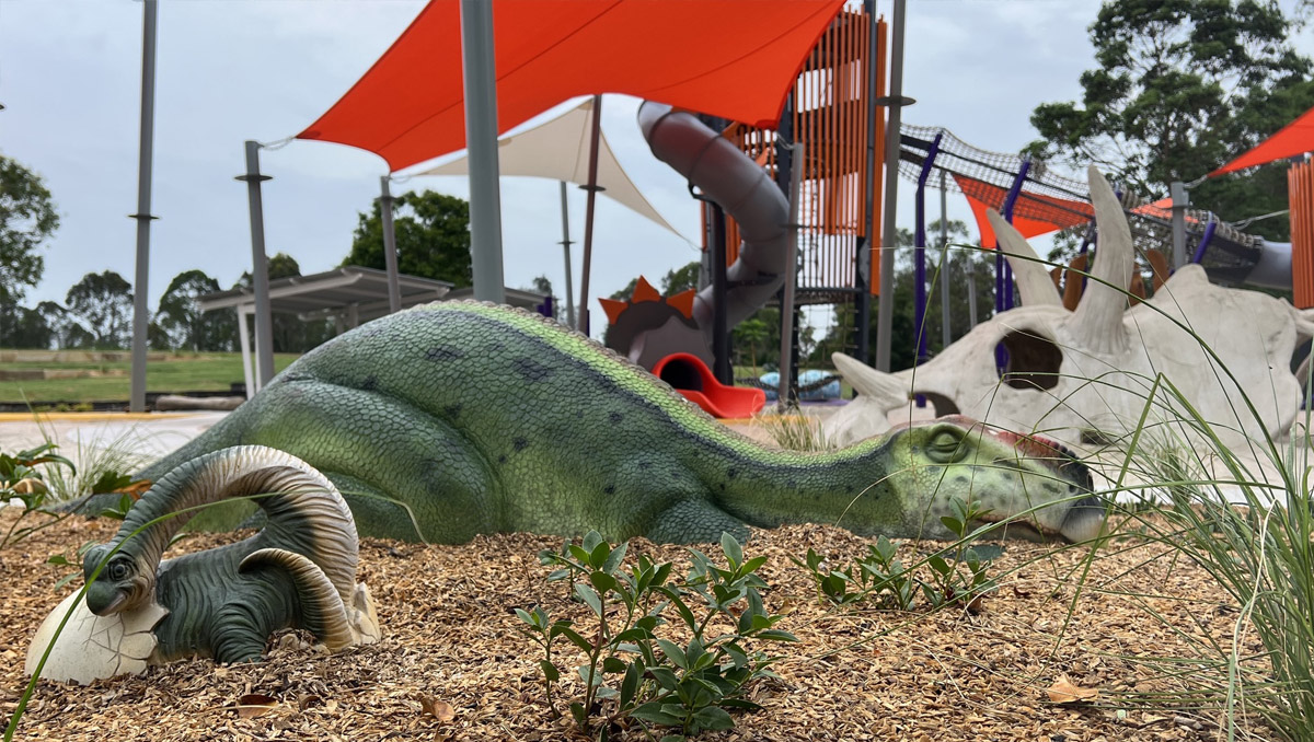 dinosaur statues on a playground