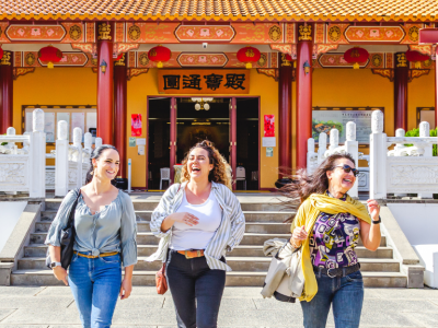 3 women laughing and walking at Chung Tian Temple