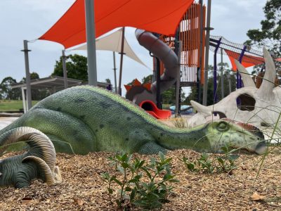dinosaur statues on a playground